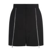 Alexander McQueen Svarta ullshorts med hög midja och silverfärgad drag...