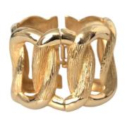 Dolce & Gabbana Guld Twisted Loop Bangle Armband Yellow, Dam