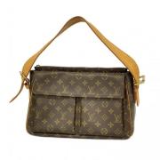 Louis Vuitton Vintage Pre-owned Tyg axelremsvskor Brown, Dam